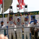 marco-werner-40-jahre-motorsport-curbs-historischer-motorsport-magazin-Auf-dem-Sieger-Podest-2005-in-Le-Mans